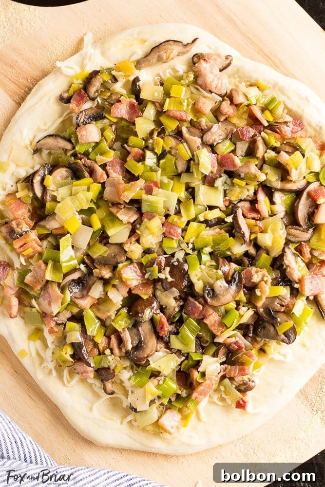Closeup of Leek, Bacon, and Mushroom Pizza toppings