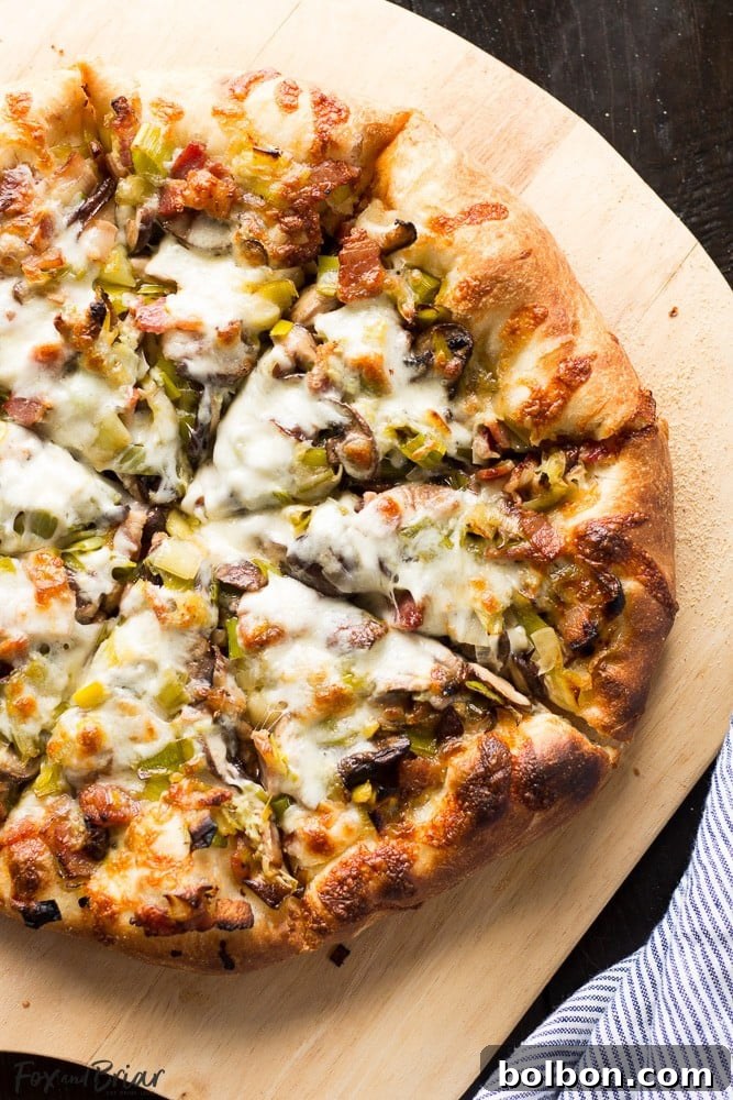 Freshly baked Leek, Bacon, and Mushroom Pizza slice