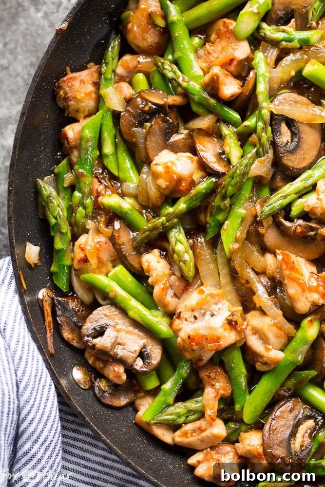 Vibrant Ginger Chicken Asparagus Stir-Fry 4 Ginger Chicken Asparagus Stir Fry being tossed in a wok or large pan