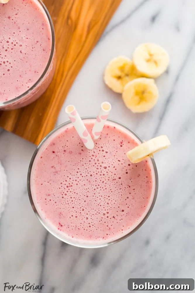Close-up of a refreshing Post Workout Smoothie with fresh fruit garnishes, highlighting its health benefits.