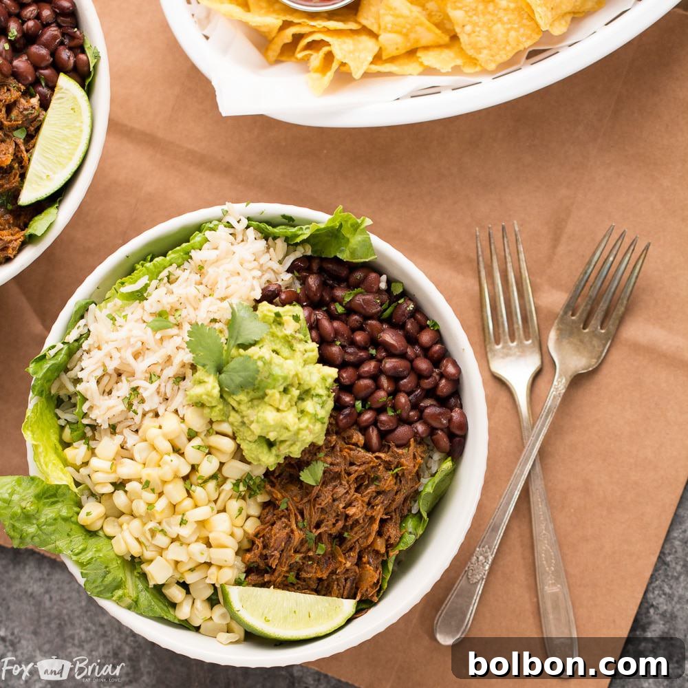 A person assembling a Slow Cooker Beef Burrito Bowl, showcasing the layering of ingredients like rice, beans, corn, and shredded beef.