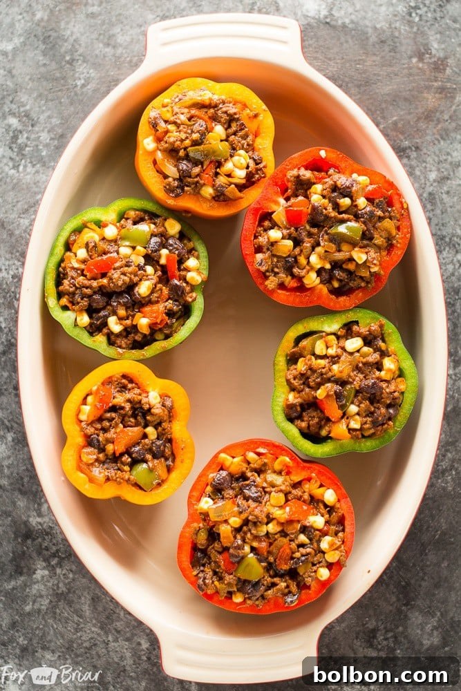 Fiesta Stuffed Peppers 3 Grain-free and gluten-free Tex-Mex Stuffed Bell Peppers, a delicious and easy family dinner with authentic Mexican flavors. Great for ground beef recipes! #ad @krogerco | Low Carb Meal | Bell Pepper Recipes | Family Dinner Ideas