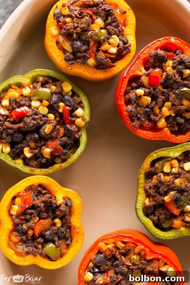 Fiesta Stuffed Peppers 4 Delicious Tex-Mex Stuffed Bell Peppers: a healthy, grain-free, and gluten-free dinner solution. Ideal for family meals and ground beef lovers. #ad @krogerco | Quick Dinner Recipes | Mexican Food Inspiration | Bell Pepper Dishes