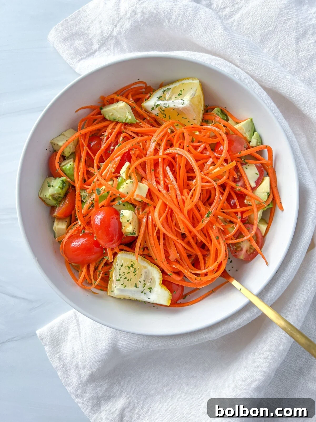 Jessica's Glow Salad 2 The Jessica Alba Salad with vibrant carrots, cherry tomatoes, and avocado, ready to be enjoyed.