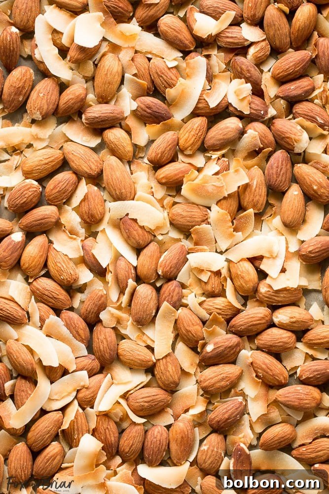 A spoonful of rich, homemade toasted coconut almond butter, a perfect keto-friendly and paleo recipe.