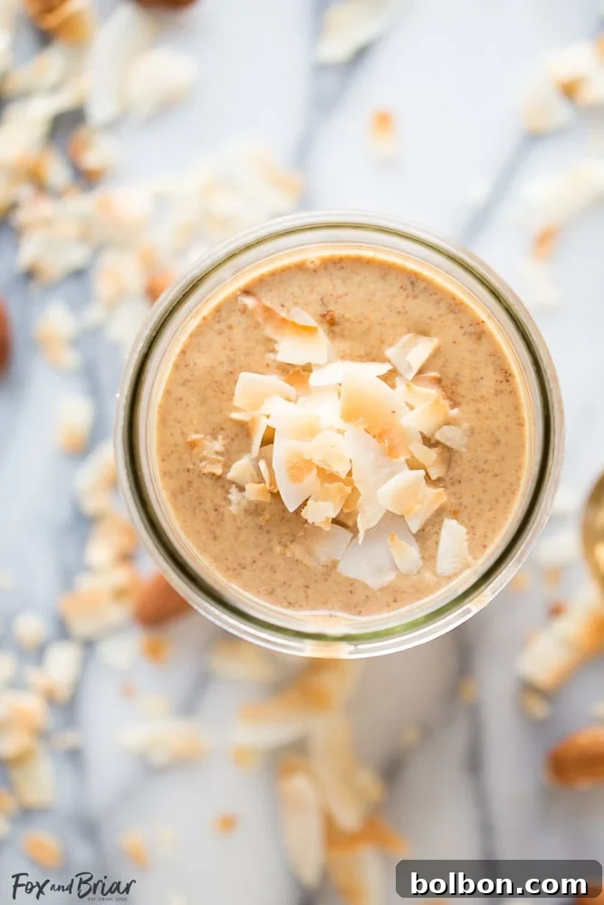 Velvet Toasted Coconut Almond Butter 8 A close-up of Toasted Coconut Almond Butter in a jar, ready for healthy snacking.
