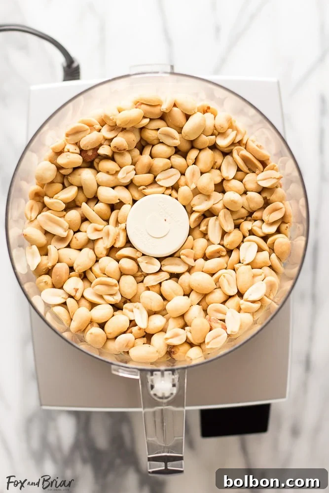 Peanuts roasting on a baking sheet, ready for the food processor to become homemade peanut butter