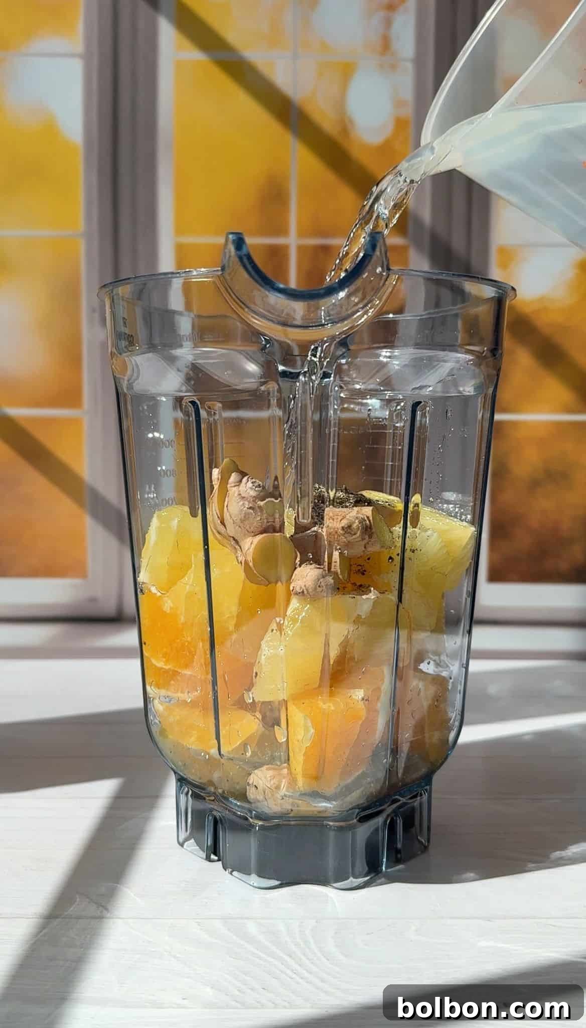 Adding water to the blender