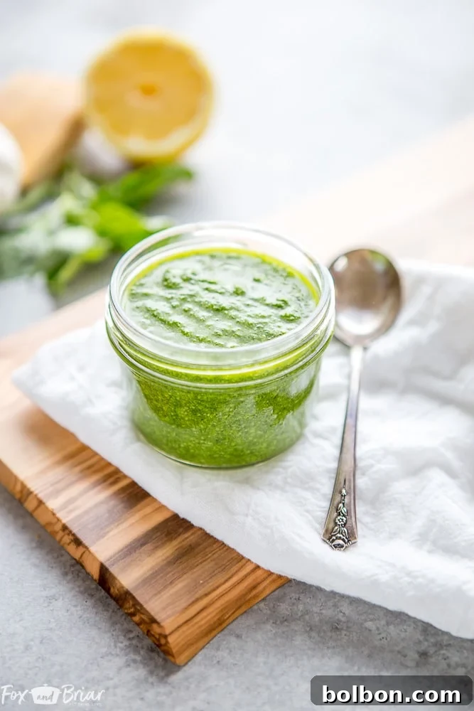Freshly made nut-free pesto in a jar, ready to be enjoyed