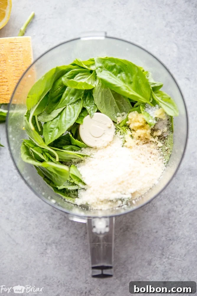 A bowl of vibrant green nut-free pesto, showcasing its rich texture