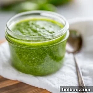 Close-up of a jar of nut-free pesto, ready for serving
