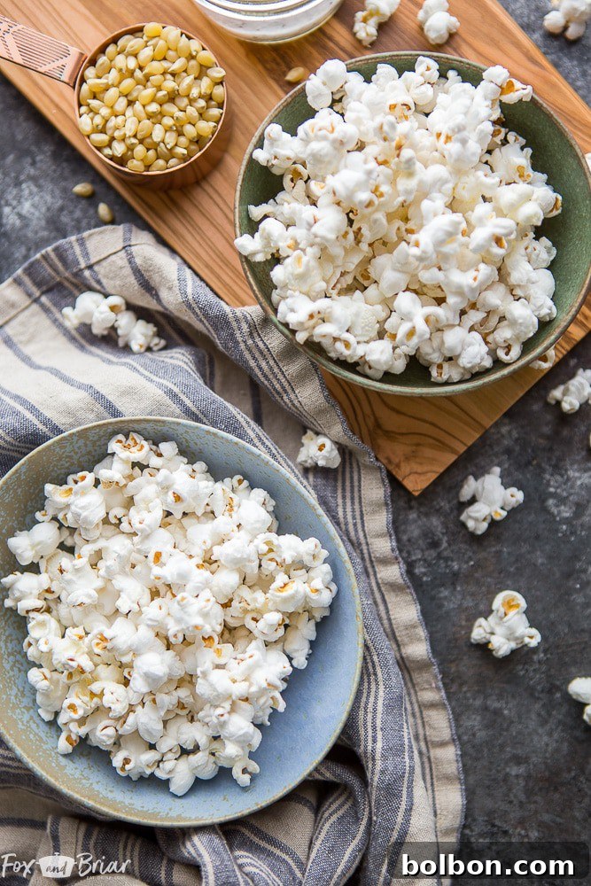 A large bowl of golden, fluffy truffle popcorn sits on a wooden surface, ready to be devoured. | homemade gourmet popcorn | quick and easy snack | truffle recipe ideas