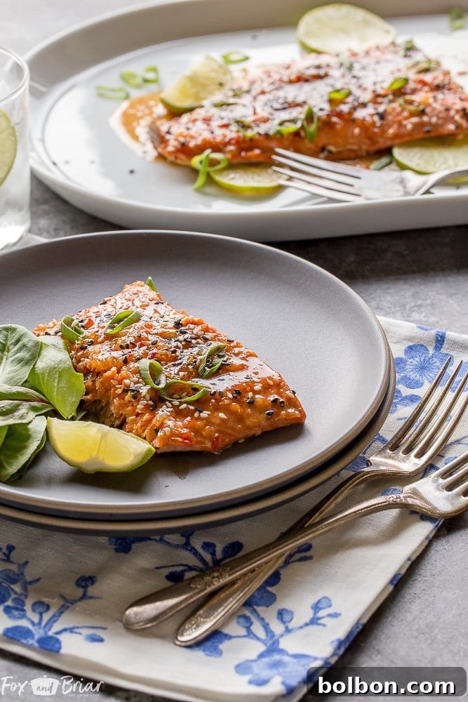Sweet Chili Garlic Glazed Salmon 4 Quick and easy Baked Sweet Chili Garlic Salmon recipe. This healthy, flavorful fish dinner is ready in under 20 minutes, offering sweet, tangy, and spicy Asian notes. A perfect family meal. | Fast and Easy Salmon | Asian Salmon Glaze | Healthy Weeknight Meal | Seafood Recipe