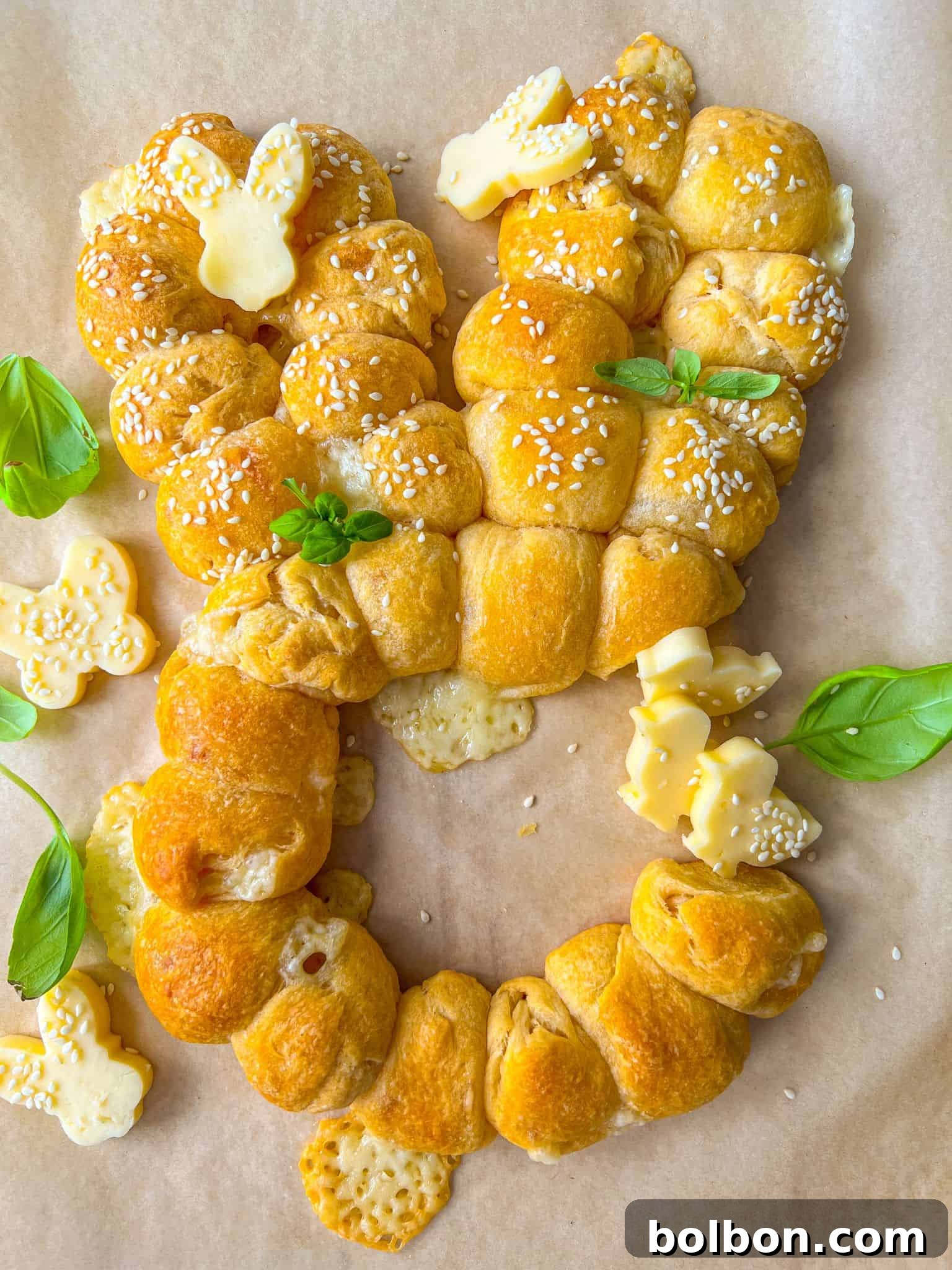 Adorable Easter Bunny Buns 3 A close-up of the delicious Easter Bunny pull-apart bread, showcasing its golden-brown crust and sesame seed topping, perfect for sharing with family and friends.