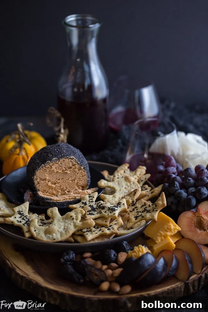 The finished roasted garlic cheese ball on a rustic wooden serving board, garnished with fresh herbs and surrounded by an assortment of crackers, highlighting its readiness for a festive gathering.