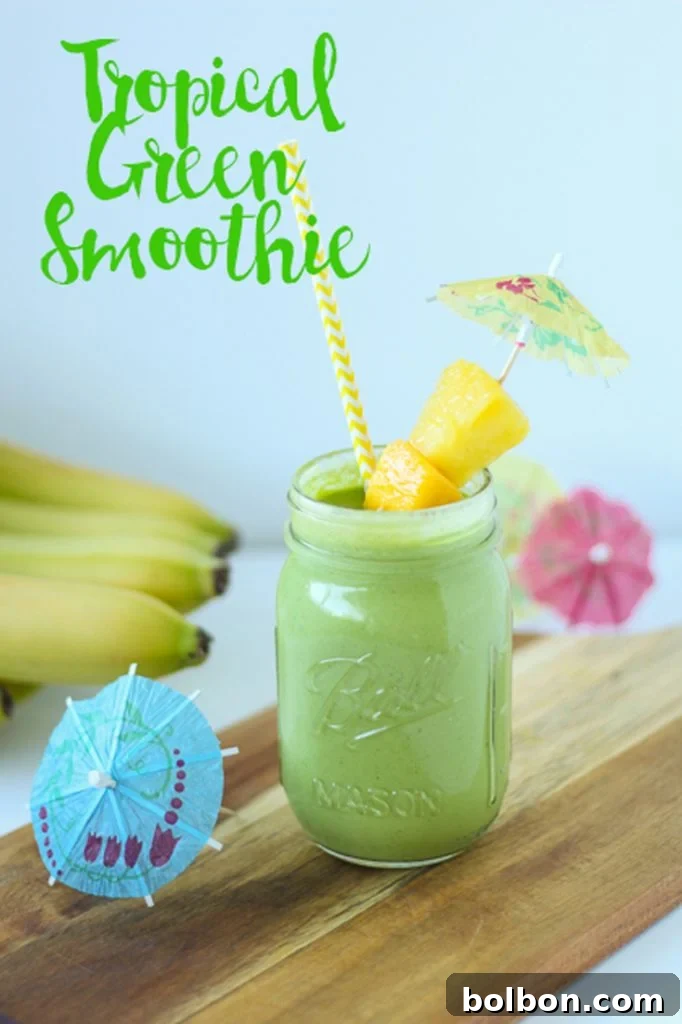 Close-up of a vibrant Tropical Green Smoothie, emphasizing its fresh ingredients.