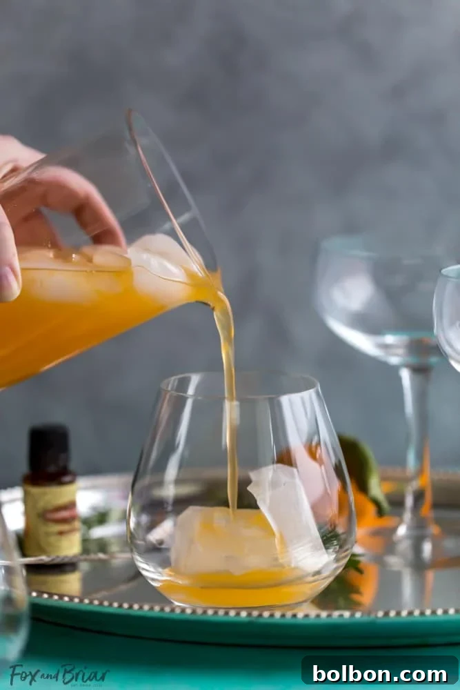 Delicious Rosemary Clementine Sparkler Mocktail ready to serve. Ideal non-alcoholic option for parties, baby showers, and teens. Enjoy a refreshing, not-too-sweet sparkling drink.