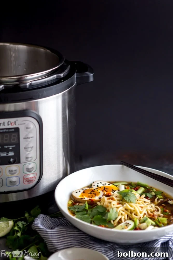A generous serving of Instant Pot Chicken Ramen, showcasing tender shredded chicken, vibrant green bok choy, and thin ramen noodles nestled in a rich, aromatic broth. Fresh green onions add a pop of color and freshness.