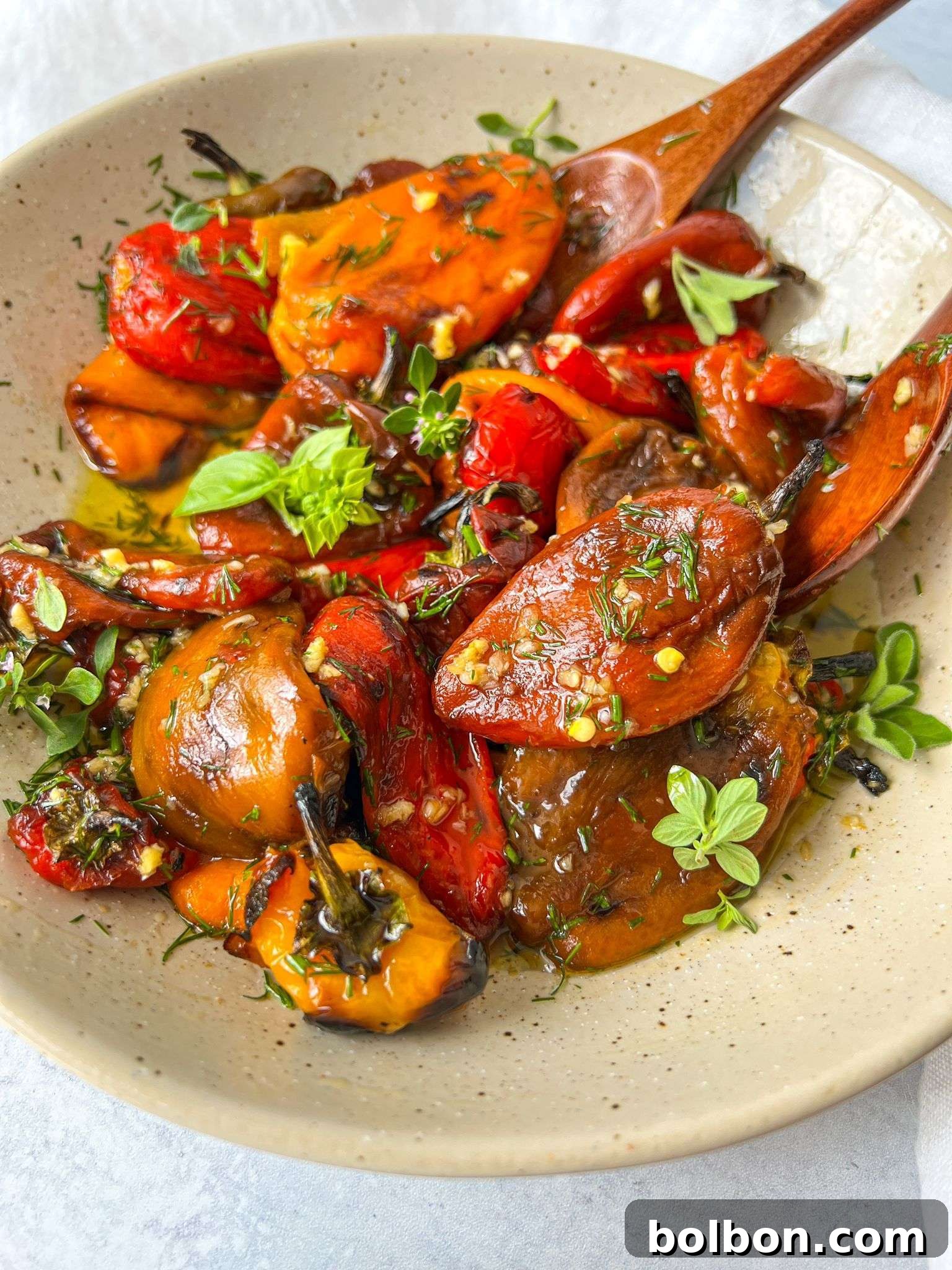 Beautifully roasted bell peppers, tender and smoky, ready to be marinated.