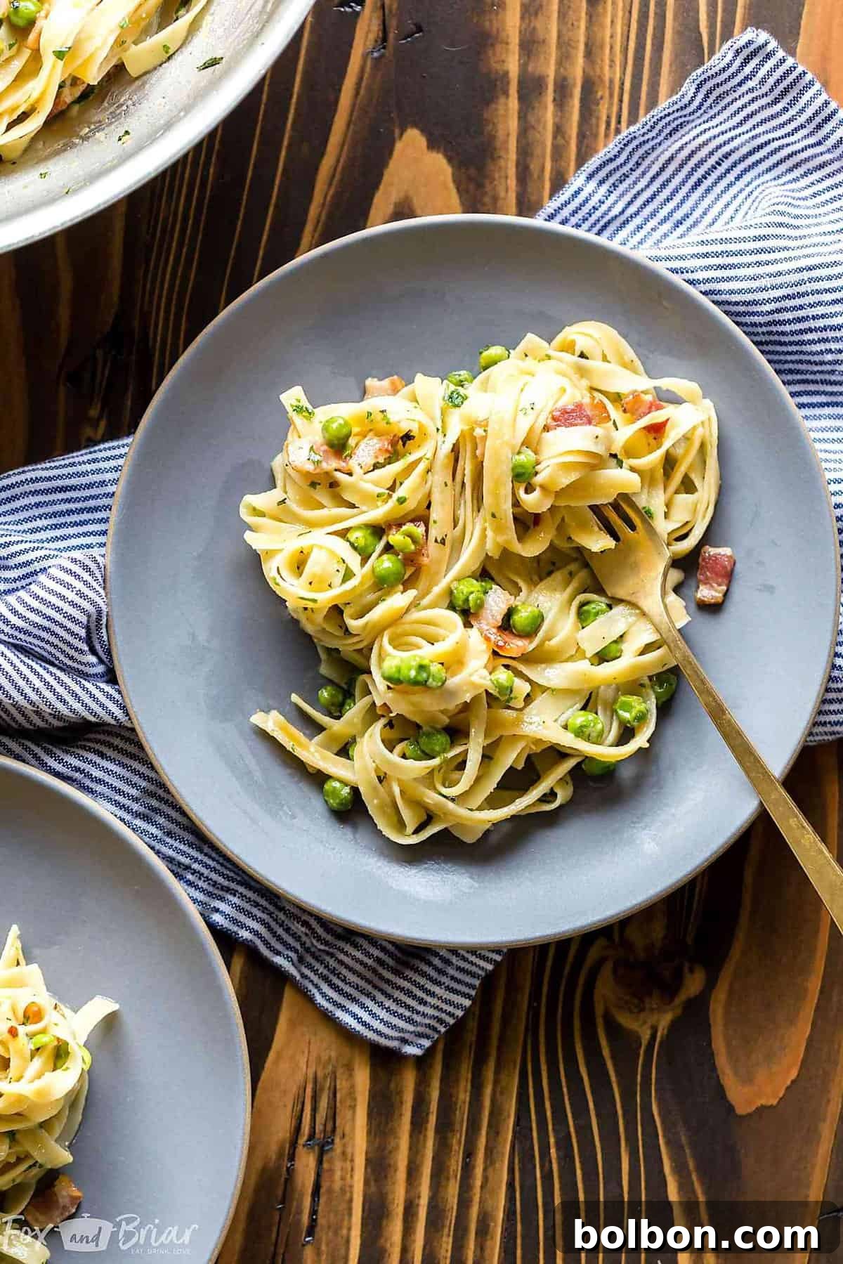 A close-up of Creamy Pasta with Pancetta and Peas, an irresistible 15-minute meal ready to be enjoyed after a convenient QFC grocery delivery.