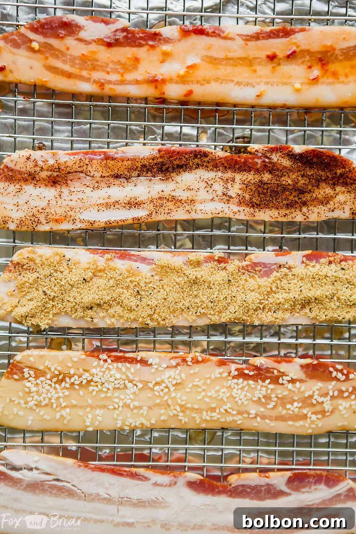 A selection of ingredients for flavored bacon: maple syrup, chili garlic sauce, honey, chipotle powder, brown sugar, black pepper, sesame oil, and sesame seeds.