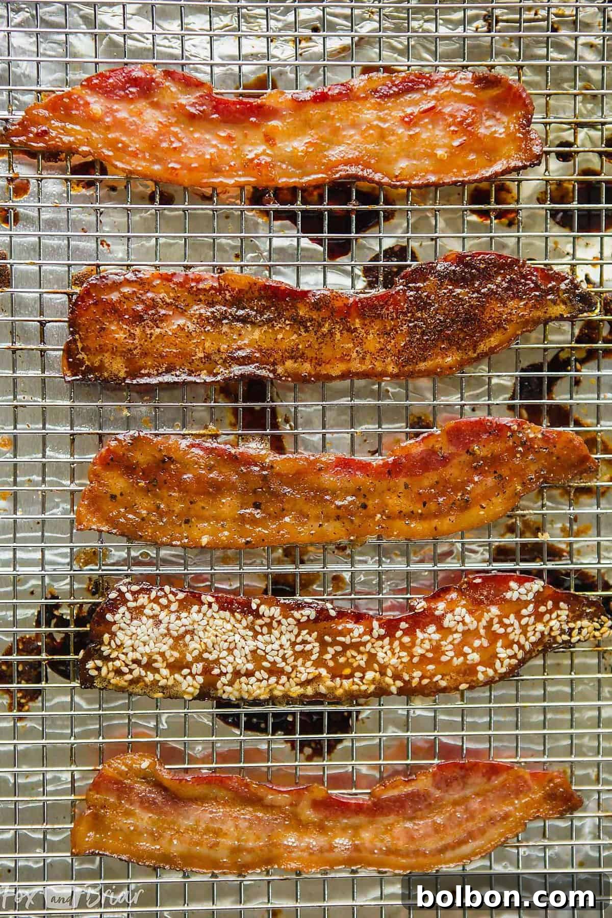 Another view of the diverse flavored bacon, emphasizing the glaze and spice textures on each strip.