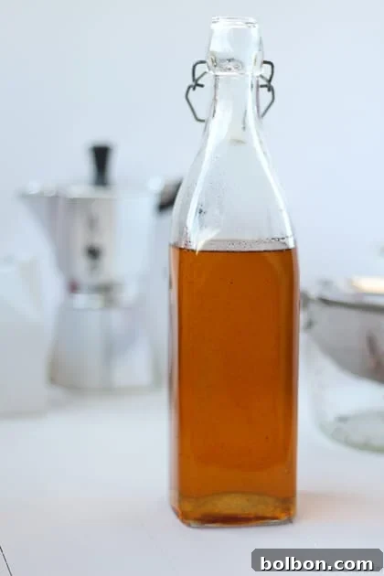 Triple Vanilla Dream 7 Bottles of homemade Triple Vanilla Syrup on a wooden surface