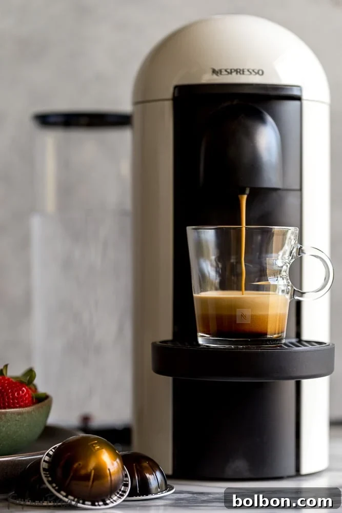 Whip Up a Cozy Brown Sugar Cinnamon Cortado 3 Nespresso VertuoPlus machine brewing double espresso
