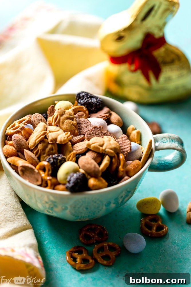 Large bowl of Bunny Bait Easter Trail Mix with serving spoons