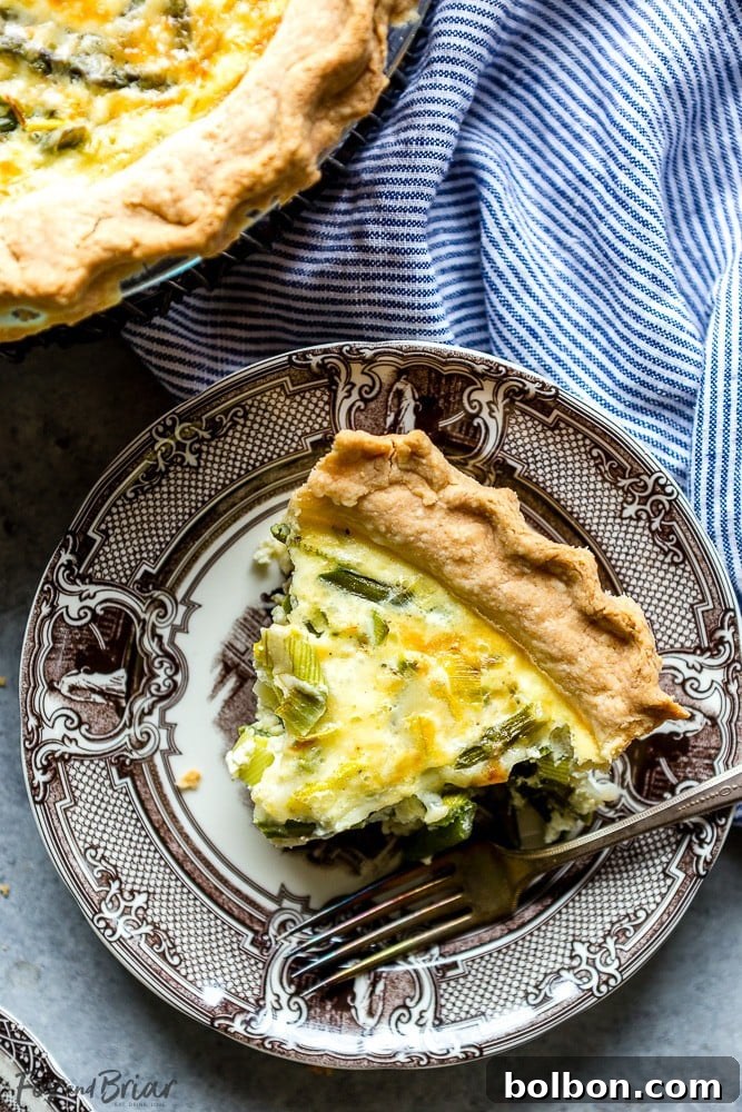 Savory Crab, Asparagus, and Leek Quiche 5 Individual serving of Crab, Asparagus, and Leek Quiche on a plate