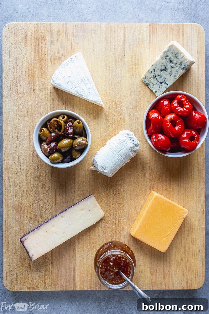 Adding small bowls of olives and dips to the charcuterie board