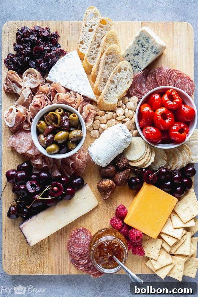 Adding crackers and bread slices to complement charcuterie and cheese