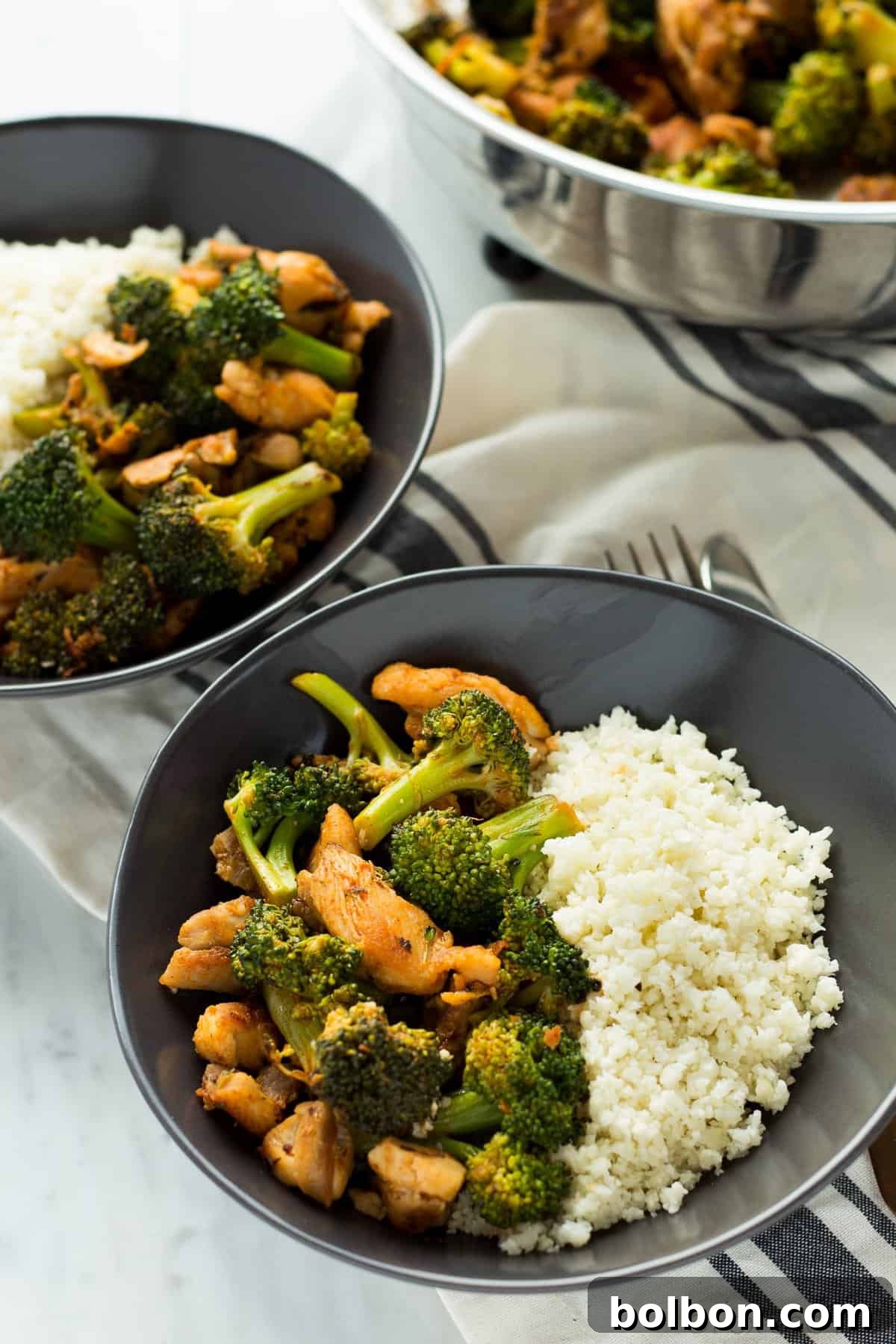 This Buffalo Chicken and Broccoli Bowl is fast, easy and flavorful. Chicken and broccoli in a buffalo sauce, served over cauliflower rice makes a gluten free, low carb, high protein, paleo and whole 30 friendly meal!