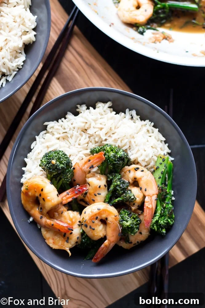 This Honey Sesame Shrimp and Broccoli is a quick and easy dinner. Shrimp and broccoli are quickly sauteed in a sweet and savory sauce that everyone will love! This is great served over rice or noodles, or you can use cauliflower rice or zoodles for a lower carb dinner.