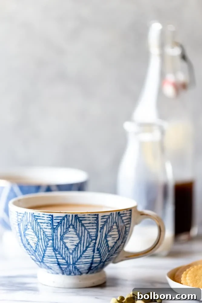 Enjoying a warm and inviting homemade Brown Sugar Cardamom Latte, a perfect fall beverage to make at home. Features the unique flavor of cardamom syrup.