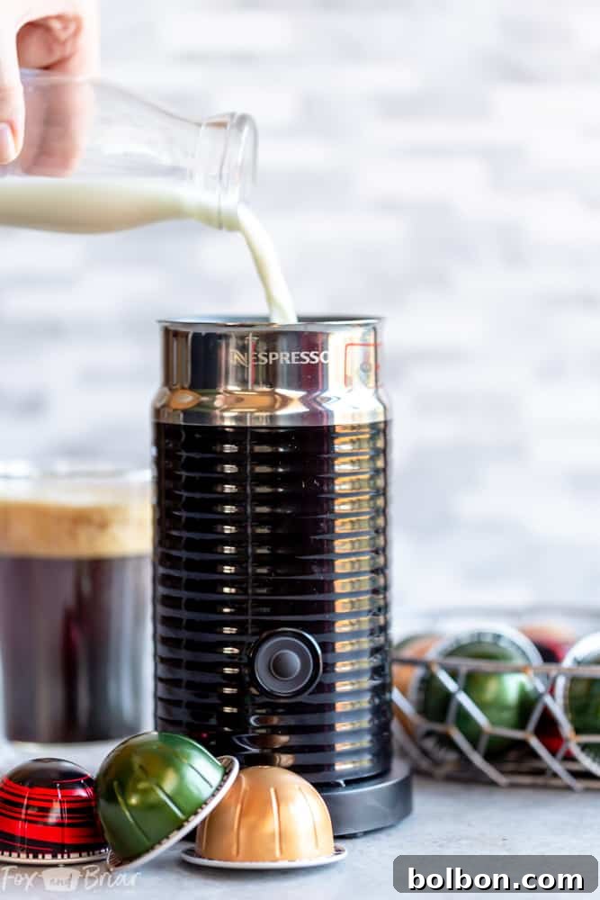 Nespresso machine brewing into a mug
