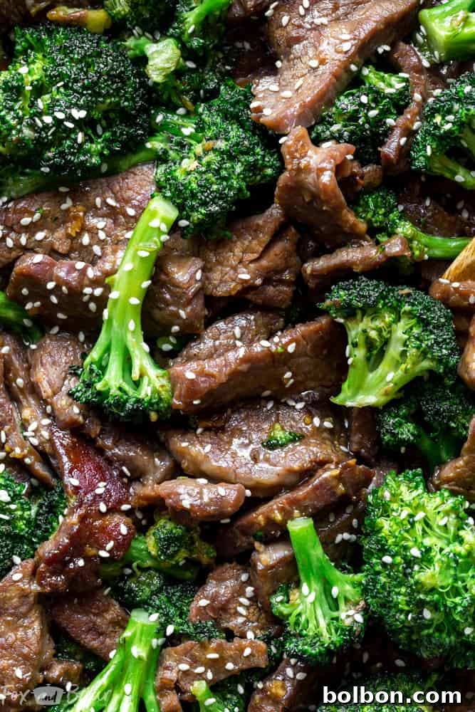 Fresh broccoli florets and thinly sliced, marinated beef ready to be cooked for a quick, healthy, and flavorful Chinese-inspired dinner.