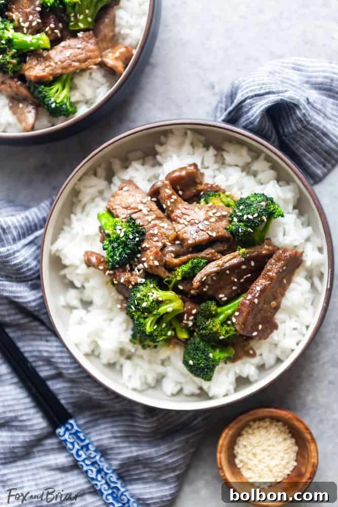 A delicious final plating of homemade Beef and Broccoli, garnished with sesame seeds, ready to be enjoyed as a quick and healthy meal.