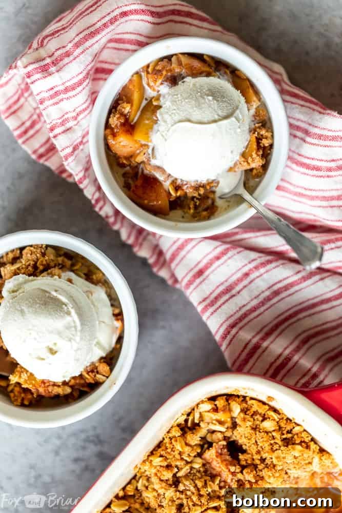 A beautifully baked apple crisp cooling on a wooden surface, ready to be enjoyed.
