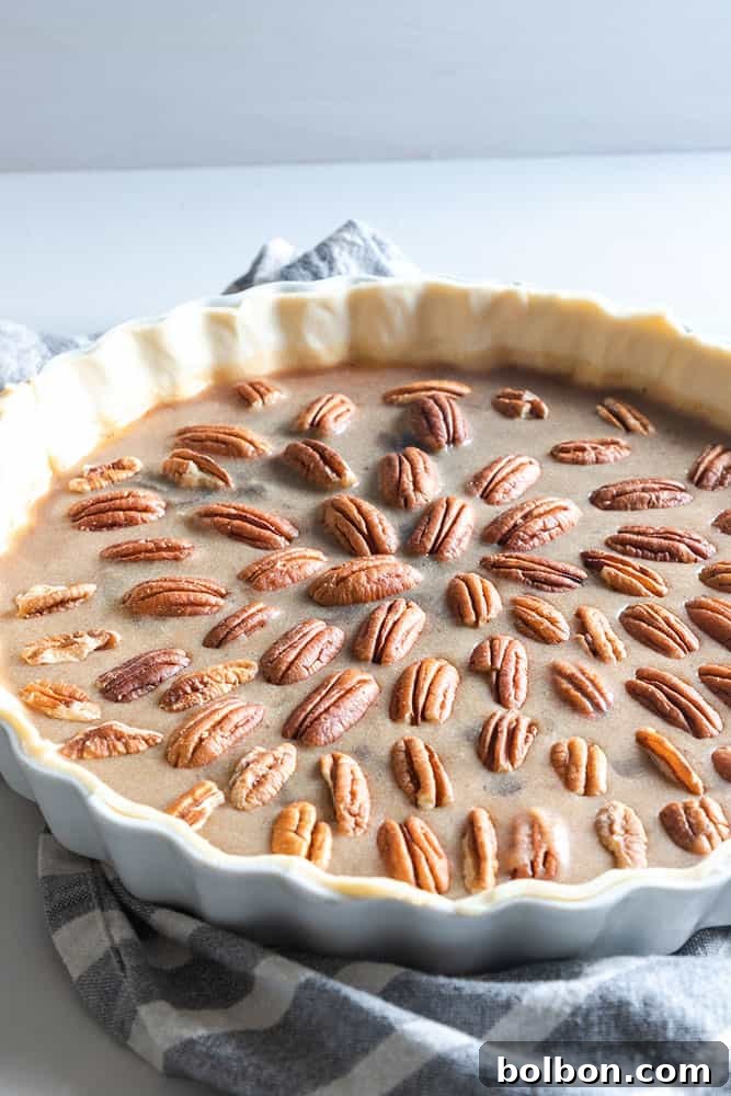 Homemade Chocolate Pecan Pie for Thanksgiving, featuring a gooey chocolate filling