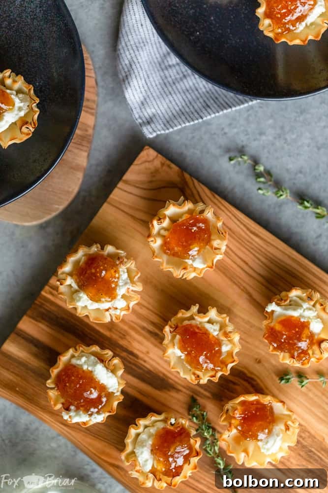 Assortment of fig and goat cheese appetizers on a serving platter