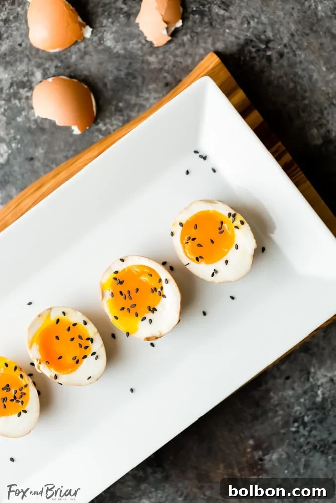 Perfectly soft-boiled Instant Pot Ramen Egg, sliced in half to show gooey yolk