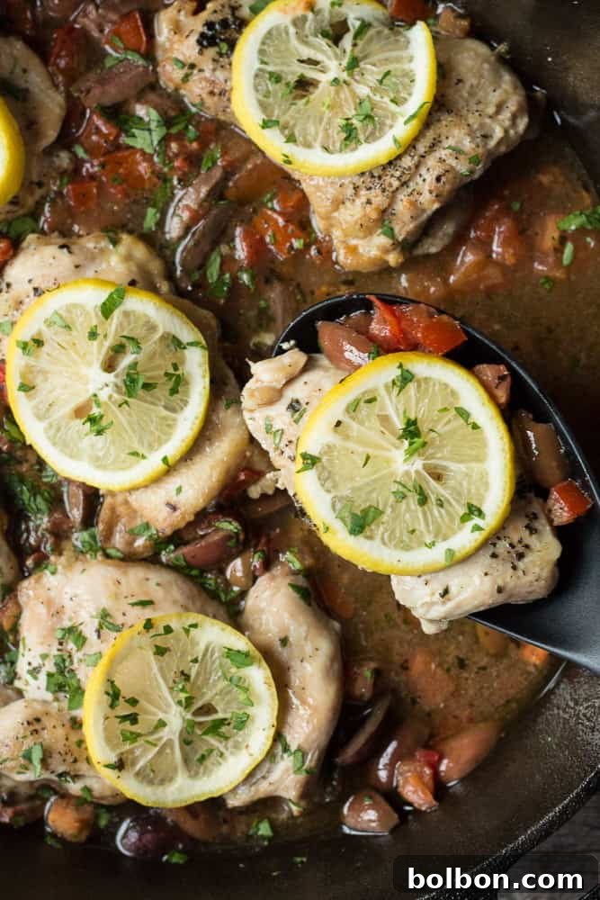 Greek Chicken Thighs recipe, simple seasoning, cast iron skillet, easy cleanup, light crisp lemon flavor, salty Kalamata olives, quick one pan dinner, weeknight meal, skillet chicken, boneless chicken thighs, easy dinner, healthy dinner, 30 minute recipe