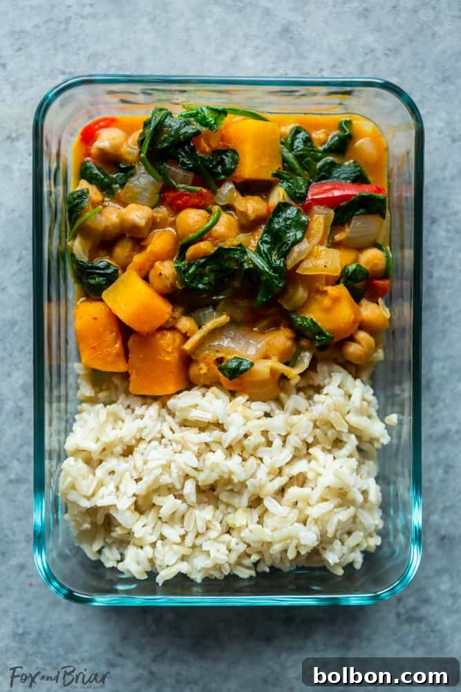 A serving of homemade chickpea and vegetable curry in a rustic bowl