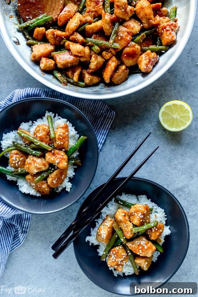 Quick Zesty Lemon Chicken Stir Fry 5 Close-up of Lemon Chicken Stir Fry being served, garnished with sesame seeds.