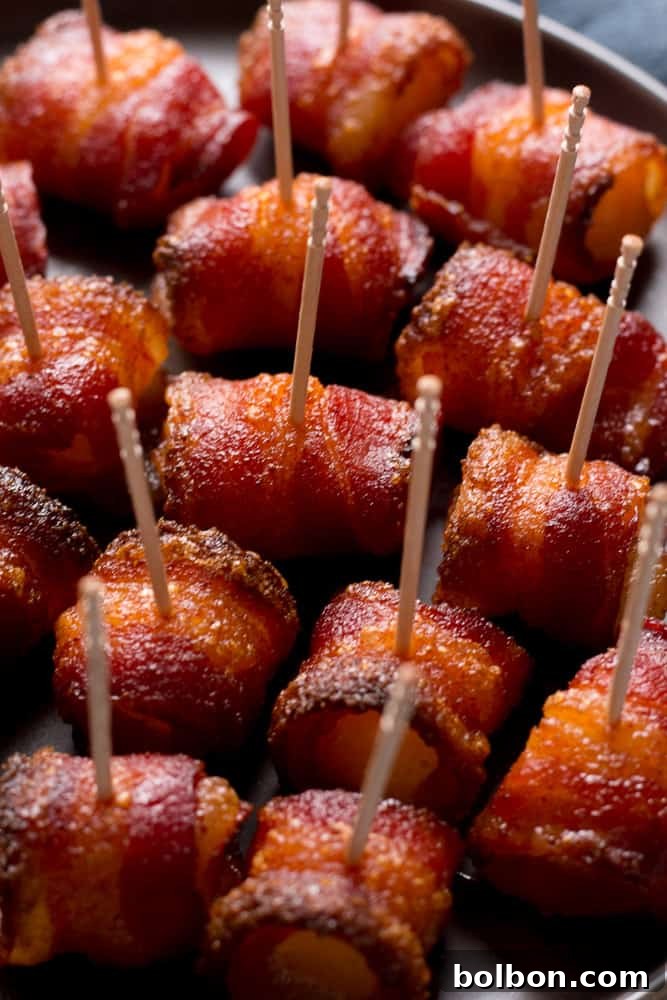 Delicious brown sugar bacon wrapped pineapple bites on a baking rack, ready to be served