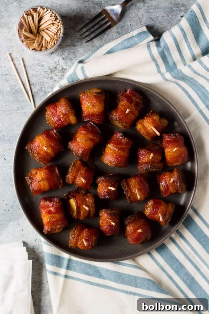 Platter of finished brown sugar bacon wrapped pineapple bites, perfect for parties