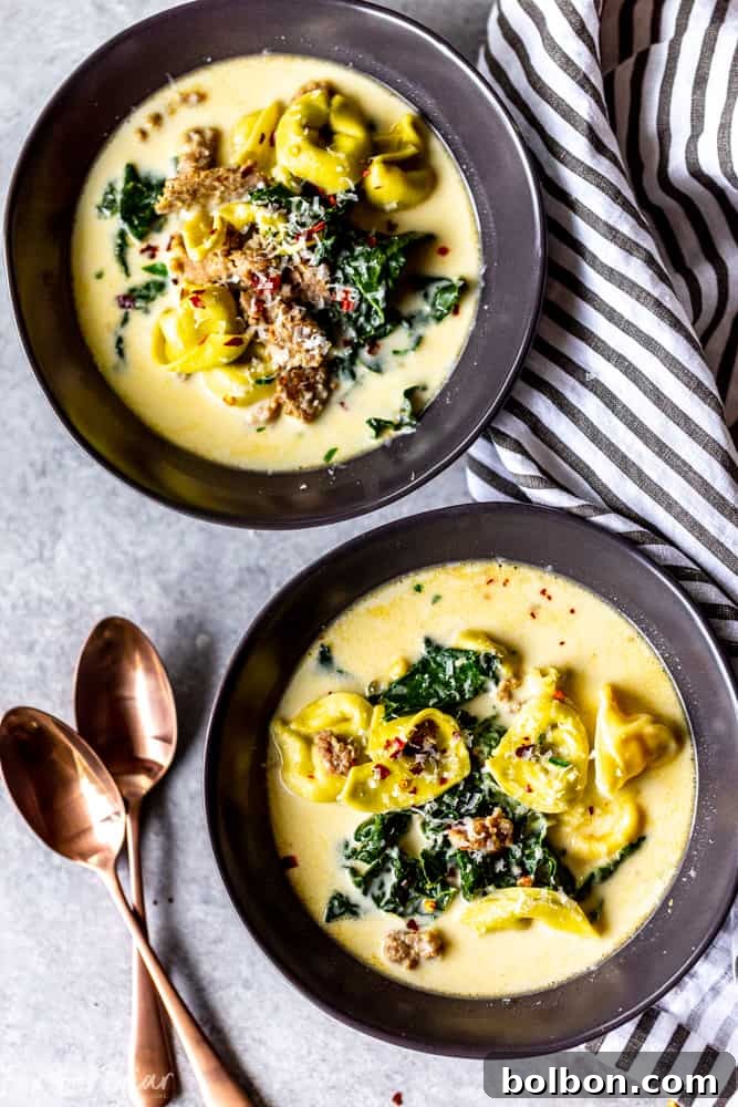 Effortless Creamy Sausage Tortellini Soup 4 Overhead view of a pot of creamy sausage and tortellini soup simmering, with all ingredients perfectly blended.