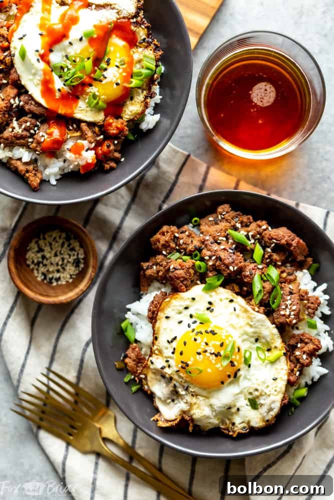 25 Fast and Easy Ground Beef Dinners 4 A vibrant close-up of Korean Ground Beef Bowls, featuring seasoned ground beef, rice, and fresh garnishes like green onions and sesame seeds, illustrating quick ground beef recipes.