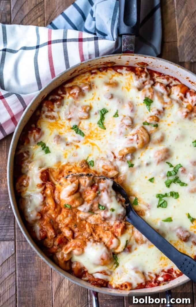 25 Fast and Easy Ground Beef Dinners 5 A mouth-watering image of Easy One-Skillet Lasagna, showing layers of pasta, rich meat sauce, and melted cheese, emphasizing effortless ground beef dinners.